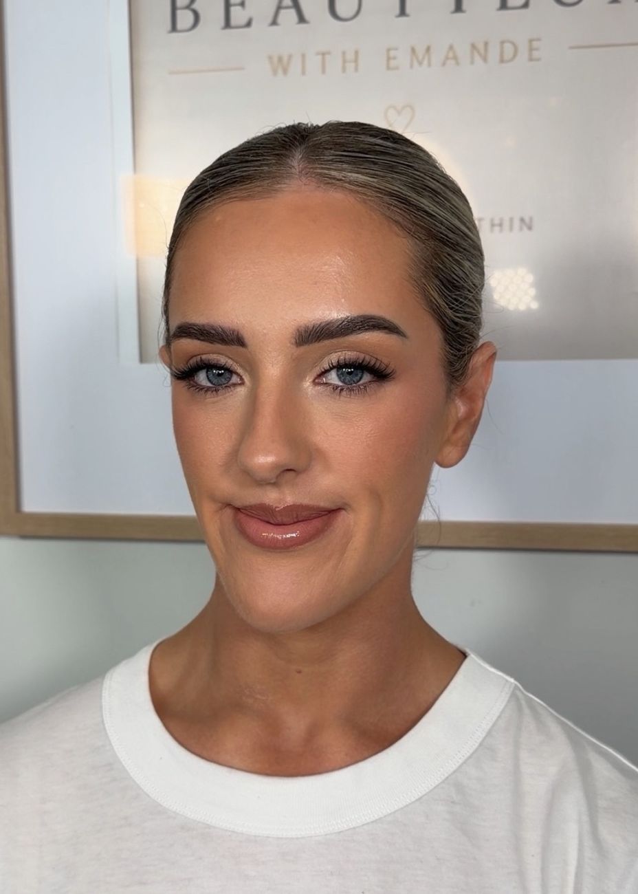 Sculpted bronze glow with fluffy lashes and a glossy nude lip
