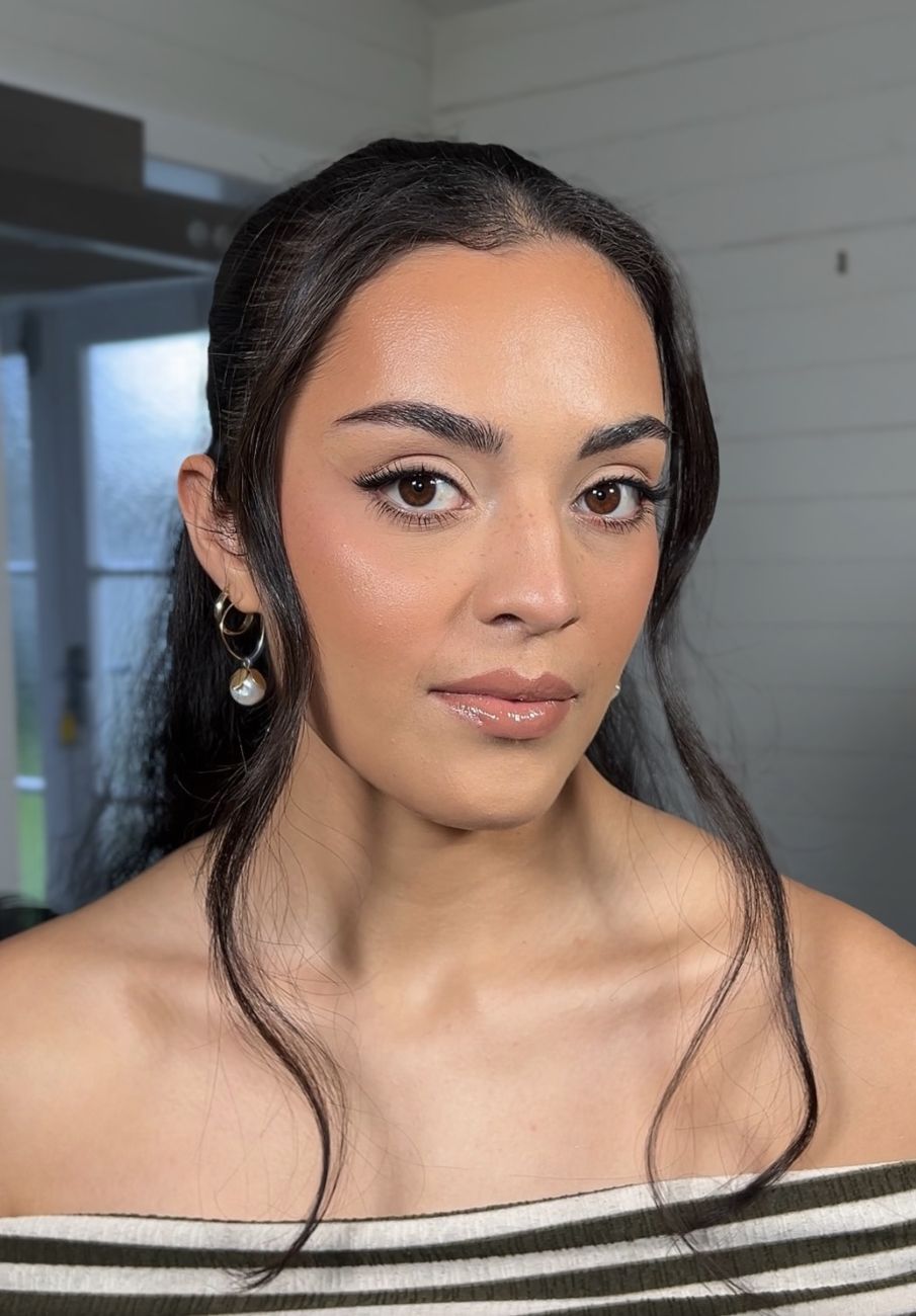 Sculpted glam with a soft winged liner, warm flush and glossy nude lip